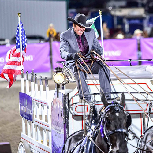 Josh Goodman riding wagon